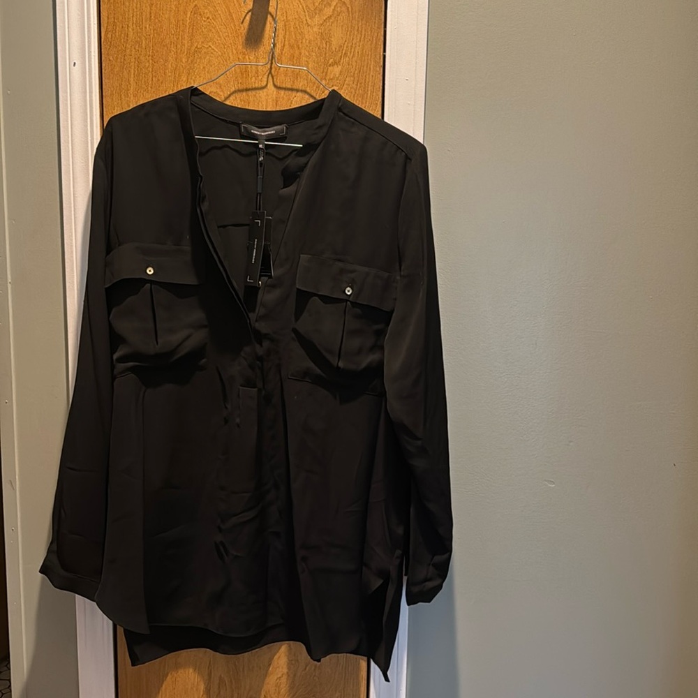 Black long sleeve blouse by Robert Rodriguez.